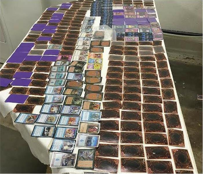 game cards being dried on a table from a water damage issue