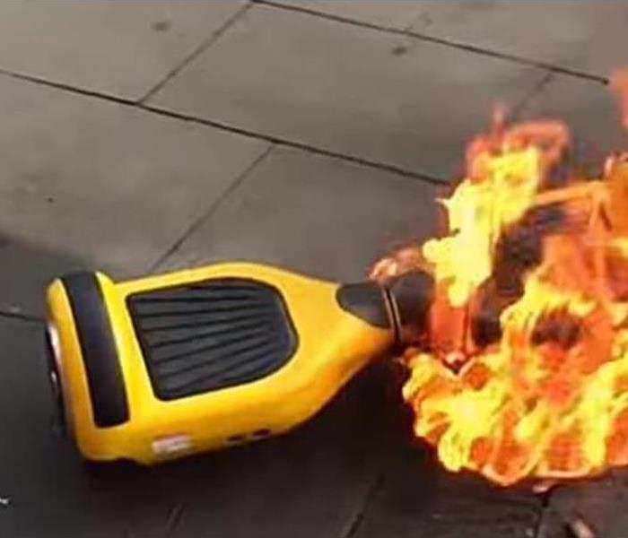 hoverboard on sidewalk on fire